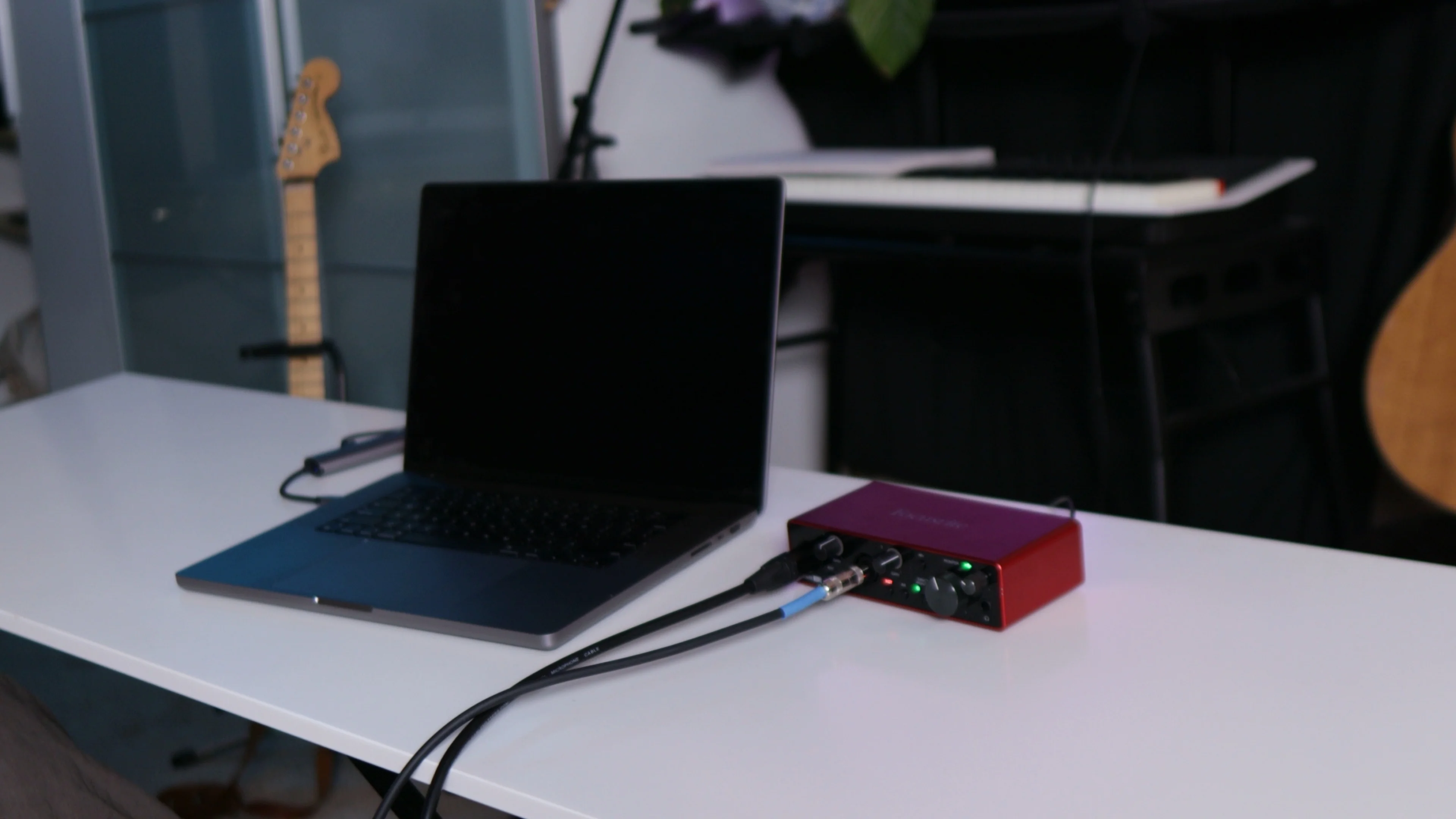 Home studio setup with audio interface, representing the technical foundation before using Logic Pro's Mastering Assistant