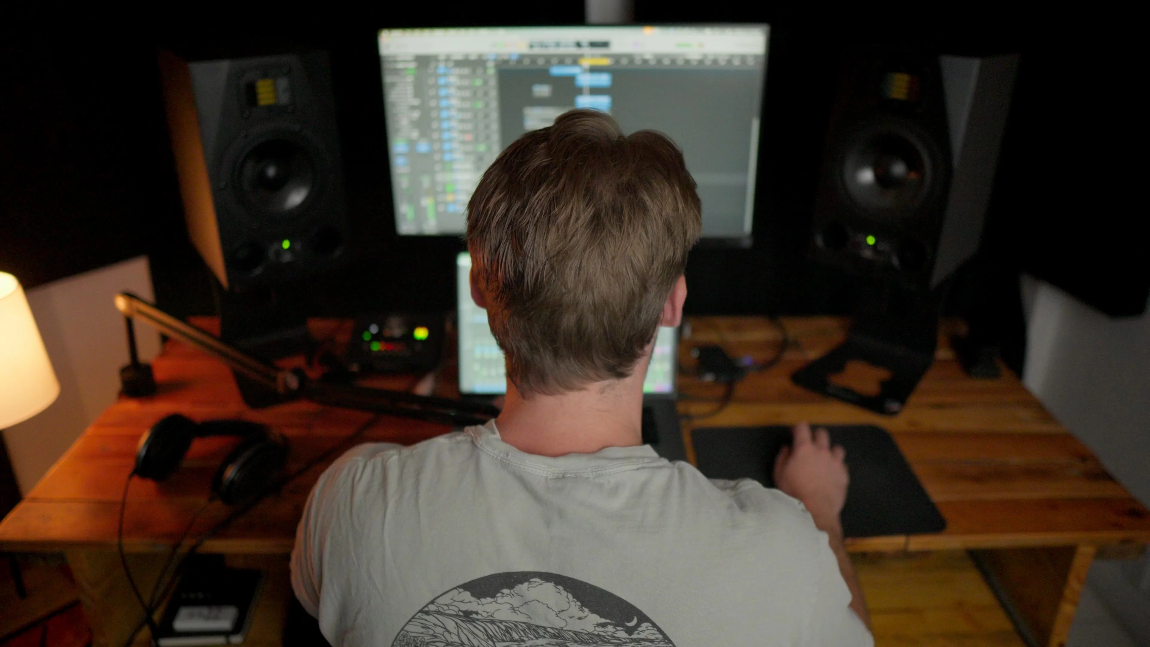 Mattie working at home studio setup with Logic Pro open on screen, showcasing the DAW for beginners