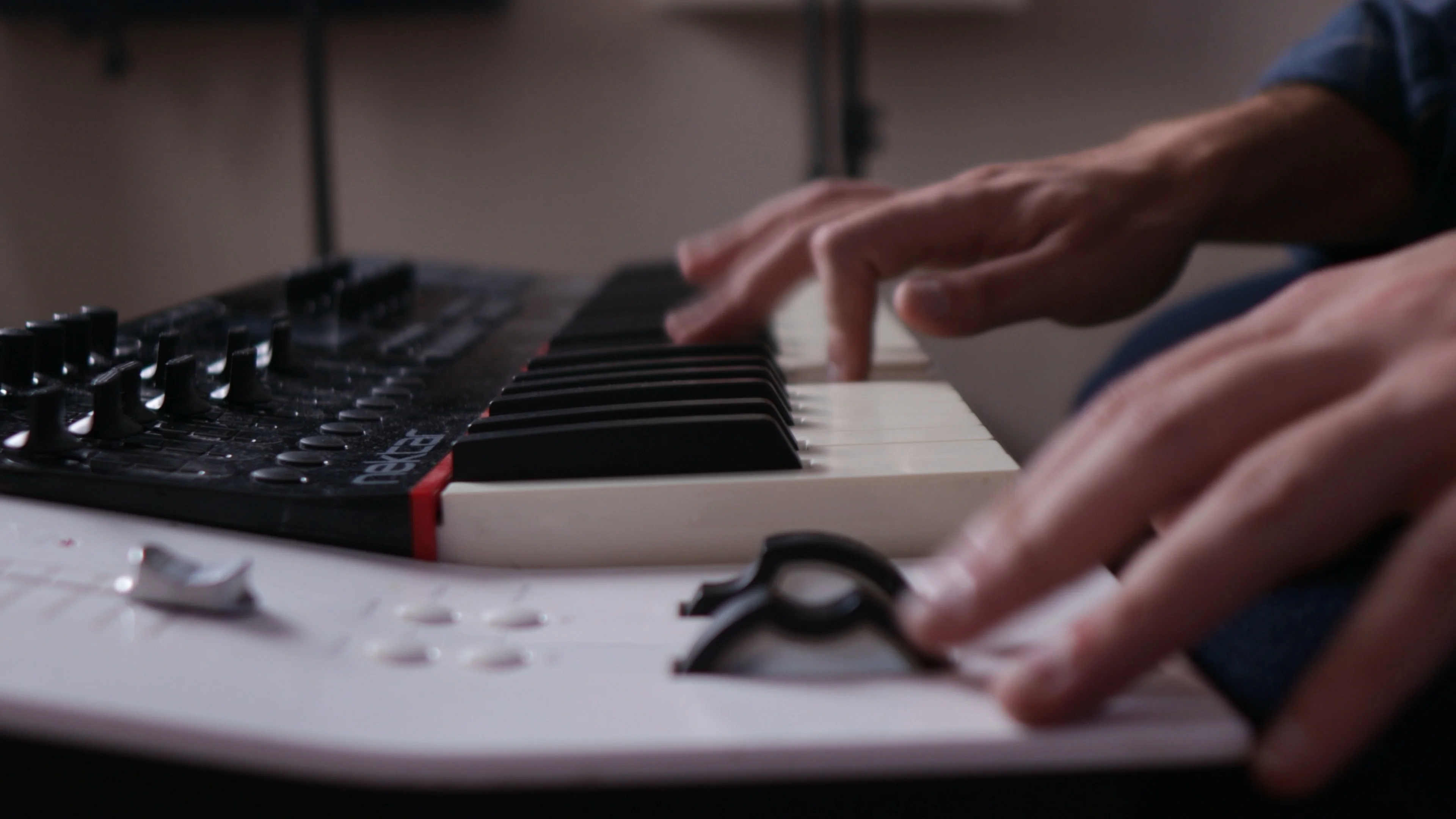 Mattie practicing daily on MIDI controller keyboard during a music production session