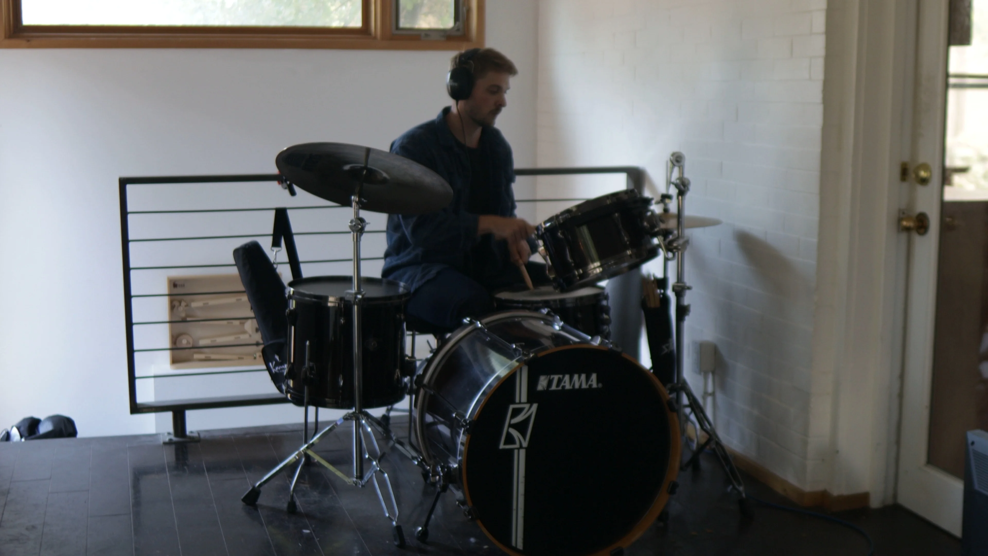 Mattie playing a Tama drum kit to evaluate drum stem separation accuracy across AI splitters