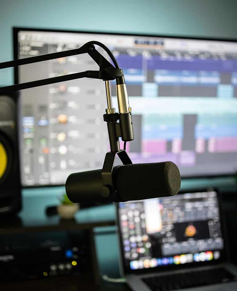 a shure sm7b in front of a music production computer
