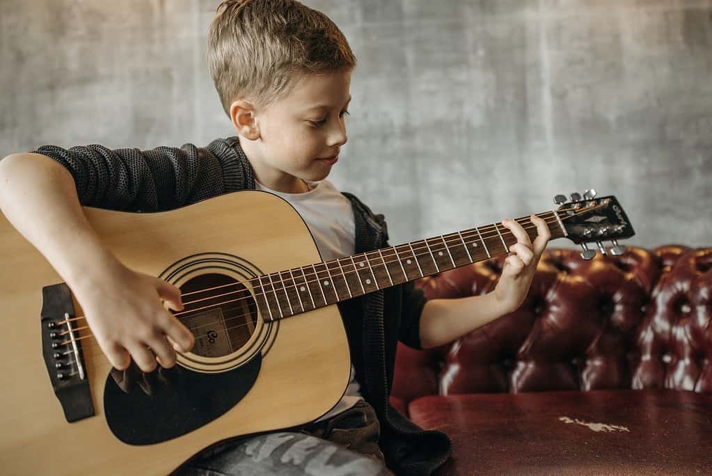 Kid Playing Acoustic Guitar